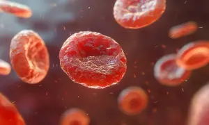 Czerwone krwinki unoszą się w krwiobiegu, a wokół nich widać drobne, czerwone fragmenty, sugerujące niskie płytki krwi.