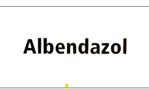 Napis "Albendazol" na białym tle. Ten lek, znany też jako Zentel, pomaga zwalczać pasożyty.
